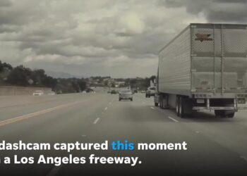 Kia flies through the air after a loose tire strikes it while driving in California