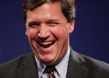 Fox News producer alleges Tucker Carlson’s team plastered photos around the office of Nancy Pelosi in a bathing suit ‘revealing her cleavage’