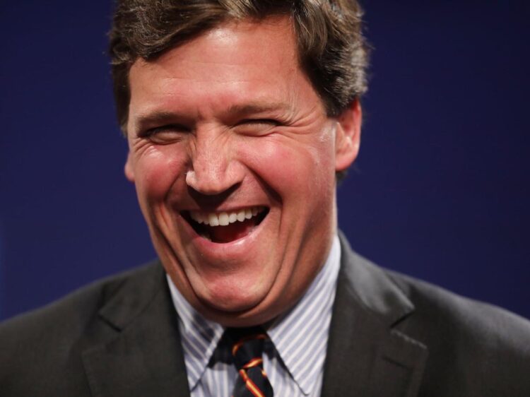 Fox News producer alleges Tucker Carlson’s team plastered photos around the office of Nancy Pelosi in a bathing suit ‘revealing her cleavage’