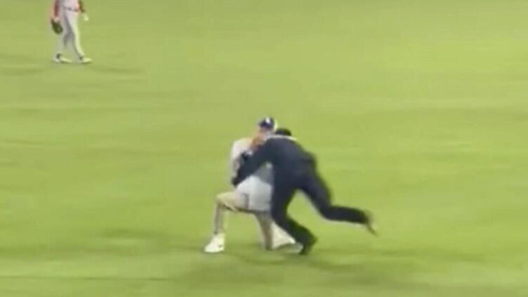 A Dodgers fan's surprise proposal goes viral after he was tackled in the outfield