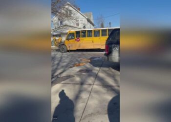 New York carjacking suspects crash into school bus full of children during police chase.mp4