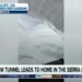 Skier on huge walls of snow surrounding home near Lake Tahoe
