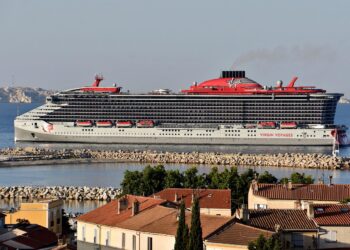 A passenger died after falling from a cruise ship balcony and landing on a lower deck, where they also struck another person