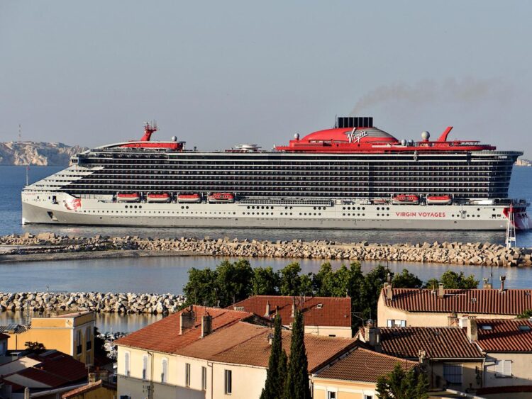 A passenger died after falling from a cruise ship balcony and landing on a lower deck, where they also struck another person