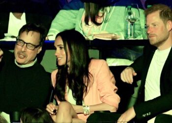 Awkward moment Meghan turns away from Prince Harry on ‘kiss cam’