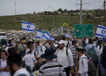 In mass rally, Israeli settlers march to West Bank outpost