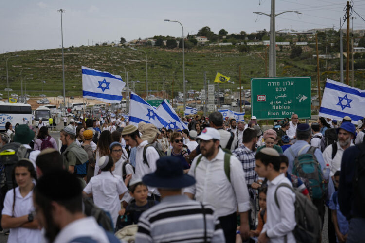 In mass rally, Israeli settlers march to West Bank outpost