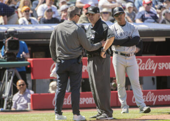 Umpire hospitalized after being hit in head by relay throw