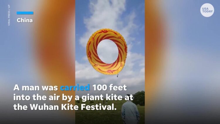 Video captures man being lifted 100 feet into the air by massive kite at festival in China
