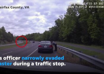Police officer narrowly escapes being hit by car skidding across Virginia highway