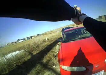 Newly released video shows police officer clinging onto fleeing car during 2021 incident