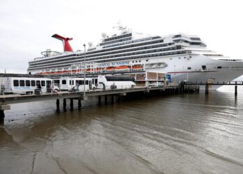 Terrifying video shows a storm flooding decks and hallways of a Carnival Sunshine cruise ship leaving passengers seasick