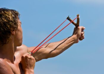 A 14-year-old boy used his slingshot to fight off someone trying to kidnap his 8-year-old sister, police say