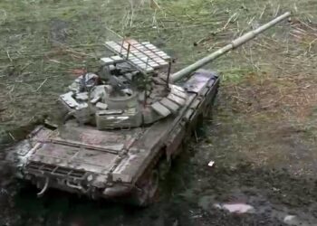 Russian Tank Debuts ‘Cope Cage’ Covered In Explosive Reactive Armor