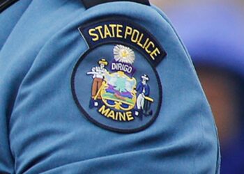 A Maine state trooper shot at a truck approaching the US-Canada border with a sign indicating there was an explosive on board, police say