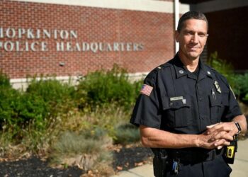 A former school resource officer at Hopkinton High has been charged with raping a student