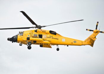 Crazy videos show a Coast Guard helicopter nearly crashing into the ocean after abandoning a rescue attempt on a Carnival cruise ship during a storm
