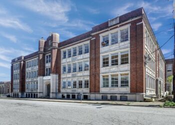 These 3 investors bought an abandoned high school for 0,000 and turned it into 31 luxury apartments. Take a look around.