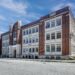 These 3 investors bought an abandoned high school for $100,000 and turned it into 31 luxury apartments. Take a look around.