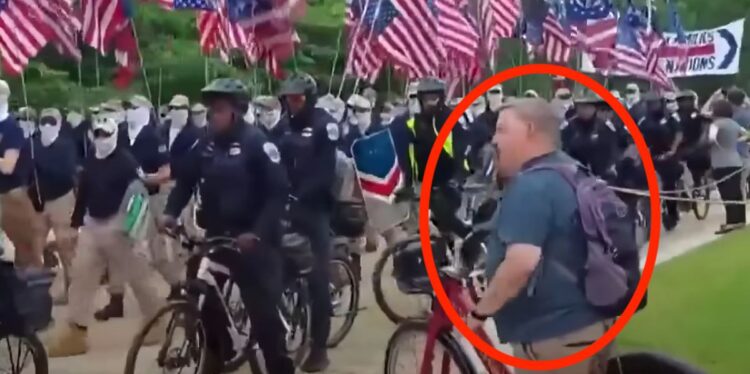 Cyclist Taunts Marching White Supremacists With Outstandingly Timed Heckles