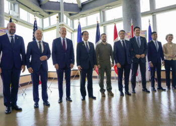 World summits’ ‘family photos’ show Putin’s isolation