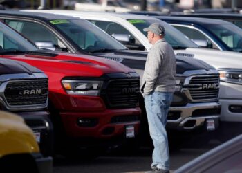 Automakers and dealers are playing a game of chicken — and customers could be the winners