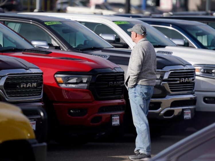 Automakers and dealers are playing a game of chicken — and customers could be the winners