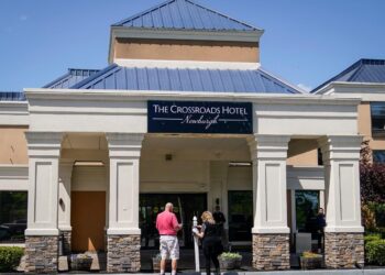 A couple’s wedding plans were upended after their hotel room block was canceled to accommodate asylum seekers rerouted from New York City