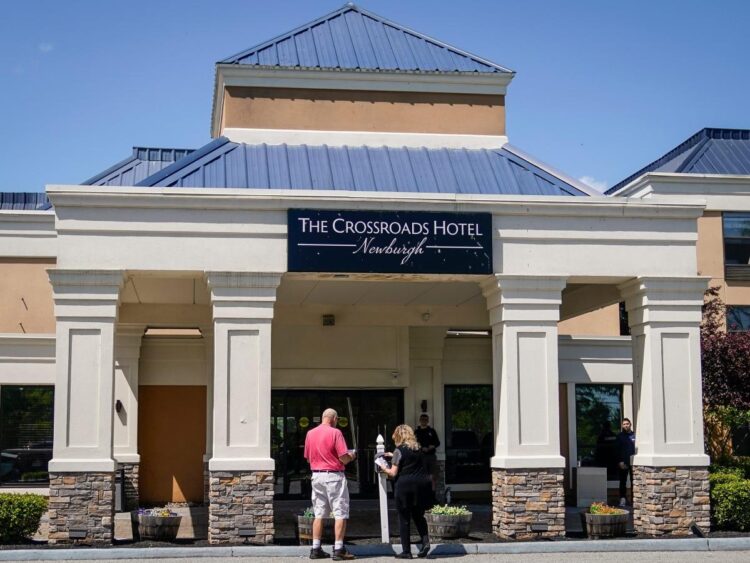 A couple’s wedding plans were upended after their hotel room block was canceled to accommodate asylum seekers rerouted from New York City