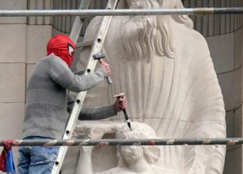 Man in Spider-Man mask scales BBC HQ to attack controversial statue