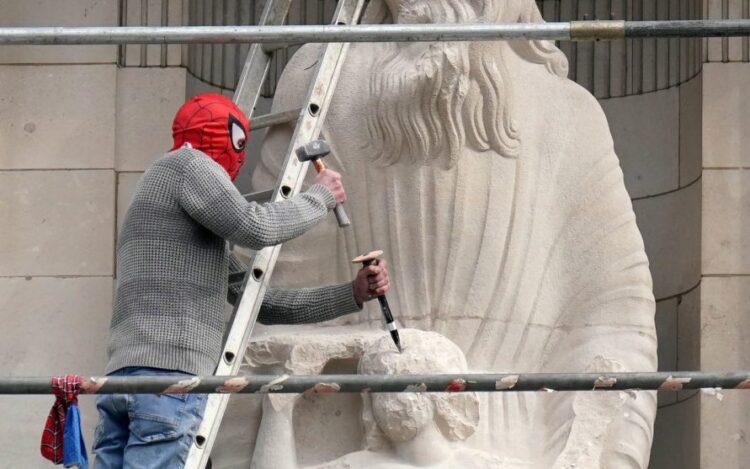 Man in Spider-Man mask scales BBC HQ to attack controversial statue