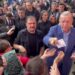 Erdogan hands cash to supporters at polling station