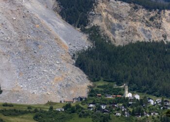 Images show how a Swiss Alps village narrowly escaped being wiped out by a massive rockslide that missed ‘by a hair’