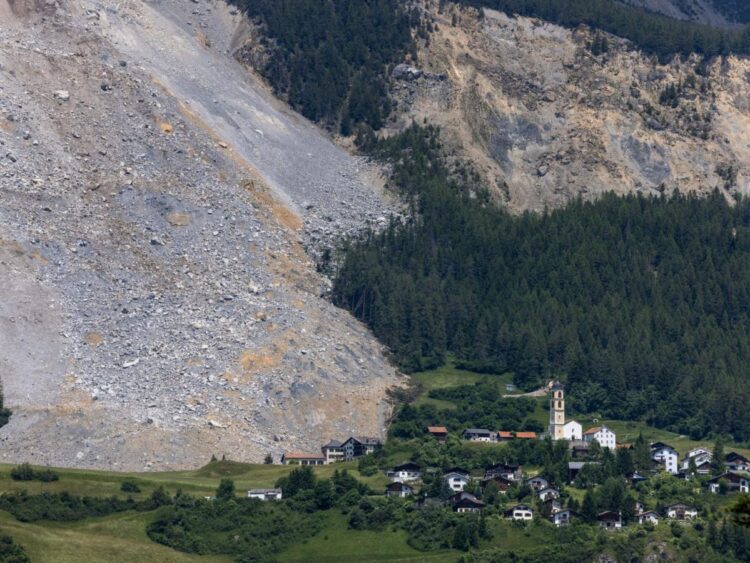 Images show how a Swiss Alps village narrowly escaped being wiped out by a massive rockslide that missed ‘by a hair’
