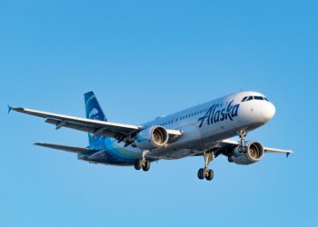 A man who emerged from a bathroom foaming at the mouth on an Alaska Airlines flight had to be restrained before reaching the cockpit, affidavit says