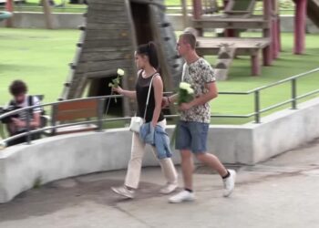 Shocked residents lay white roses at Annecy playground