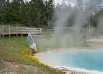 Tourist dips fingers in deadly Yellowstone hot spring, video shows. ‘It’s very hot!’