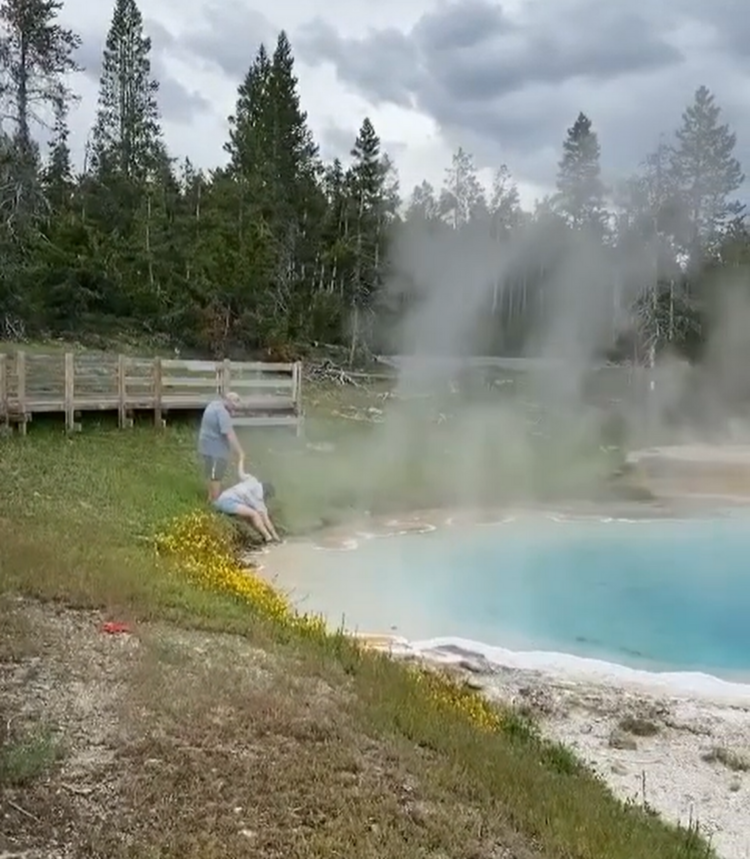 Tourist dips fingers in deadly Yellowstone hot spring, video shows. ‘It’s very hot!’