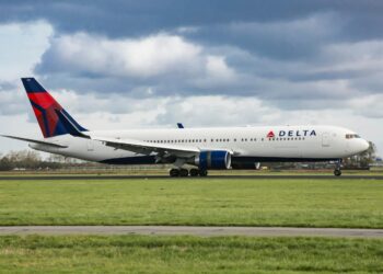 A Delta flight to New York was canceled shortly before takeoff after a crew member was arrested