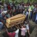 Ugandan border town buries victims of rebel massacre that left 42 dead, mostly students