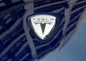 Putin issues warning, Carnival stocks falls, Tesla downgrade: Top stories