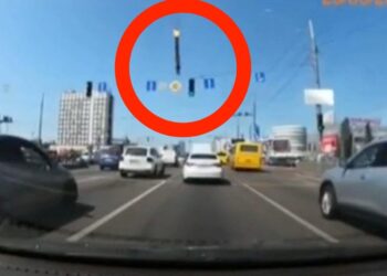 Dashcam footage shows the terrifying moment part of a missile narrowly misses a moving car in Kyiv