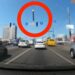 Dashcam footage shows the terrifying moment part of a missile narrowly misses a moving car in Kyiv