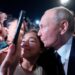 Putin, a germaphobe known for meeting with people at ridiculously long tables, took selfies kissing regular Russians this week
